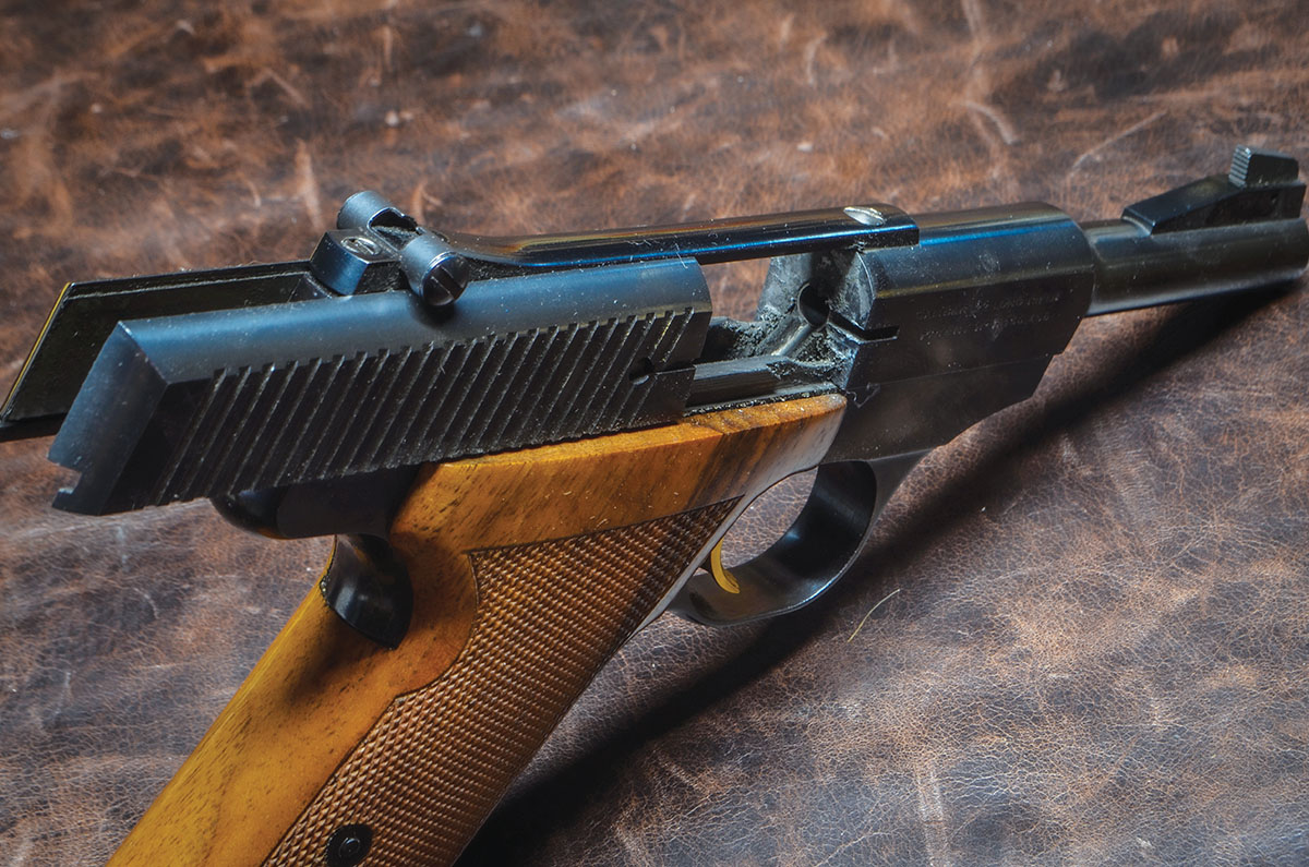 The Challenger’s rear sight was on a separate rib attached to the barrel, so it did not move as the slide recoiled.